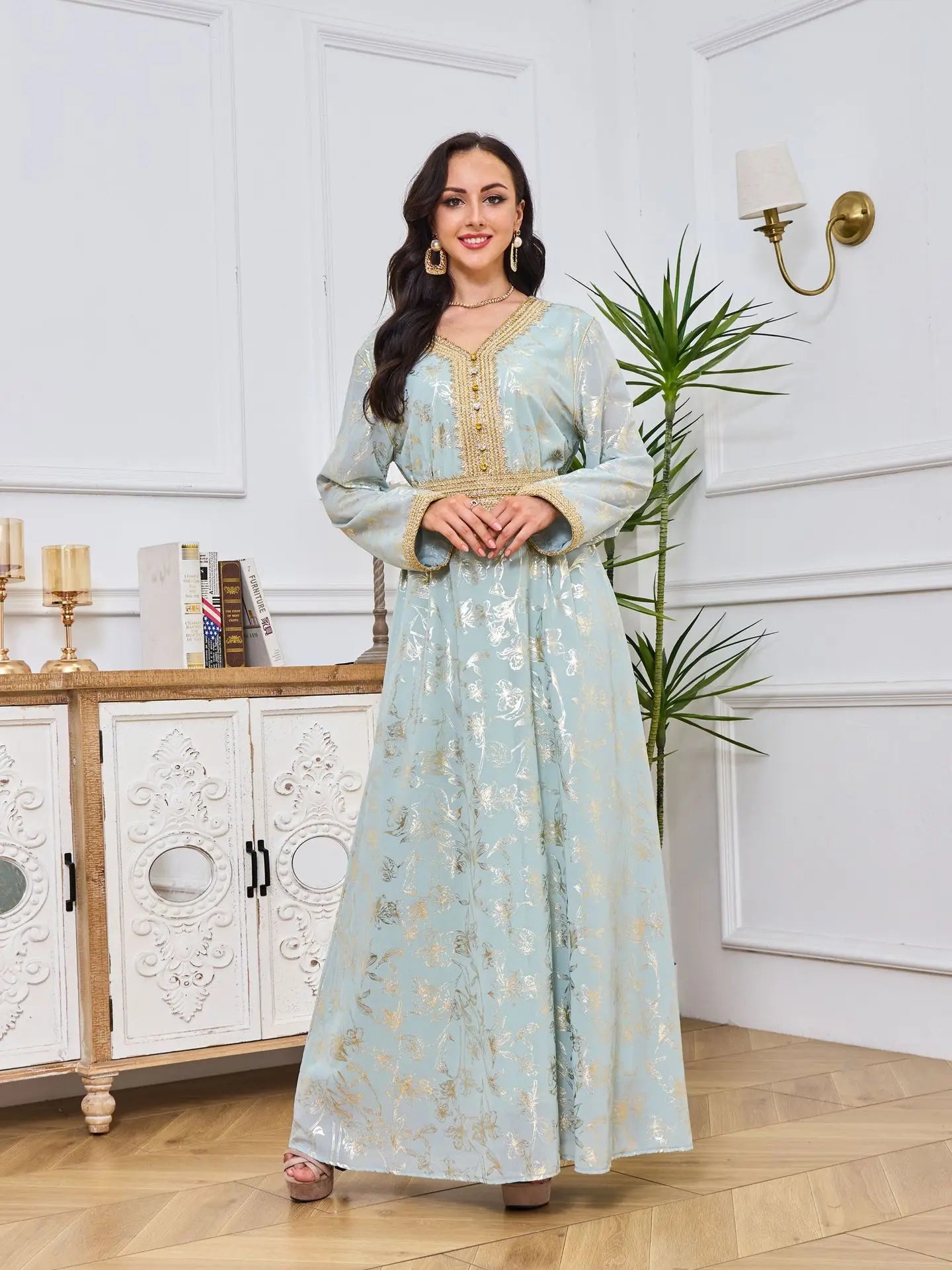 Model wearing the stunning golden velvet abaya with sequins, epitomising elegance and modesty in contemporary Muslim attire.