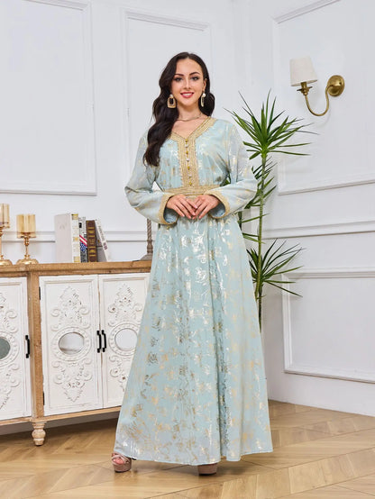 Model wearing the stunning golden velvet abaya with sequins, epitomising elegance and modesty in contemporary Muslim attire.