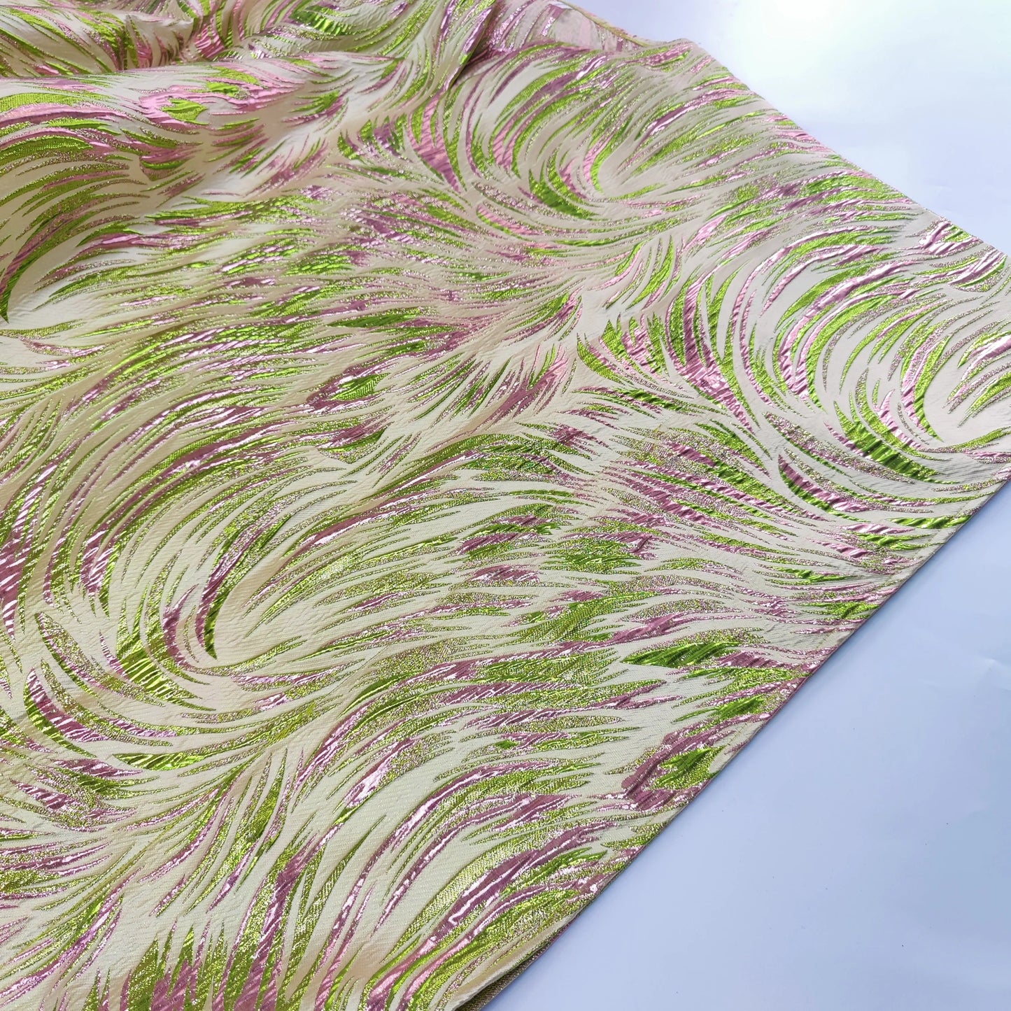 Close-up of the exquisite brocade fabric used in the luxury African boubou dress, showcasing intricate patterns and vibrant colors ideal for special occasions.