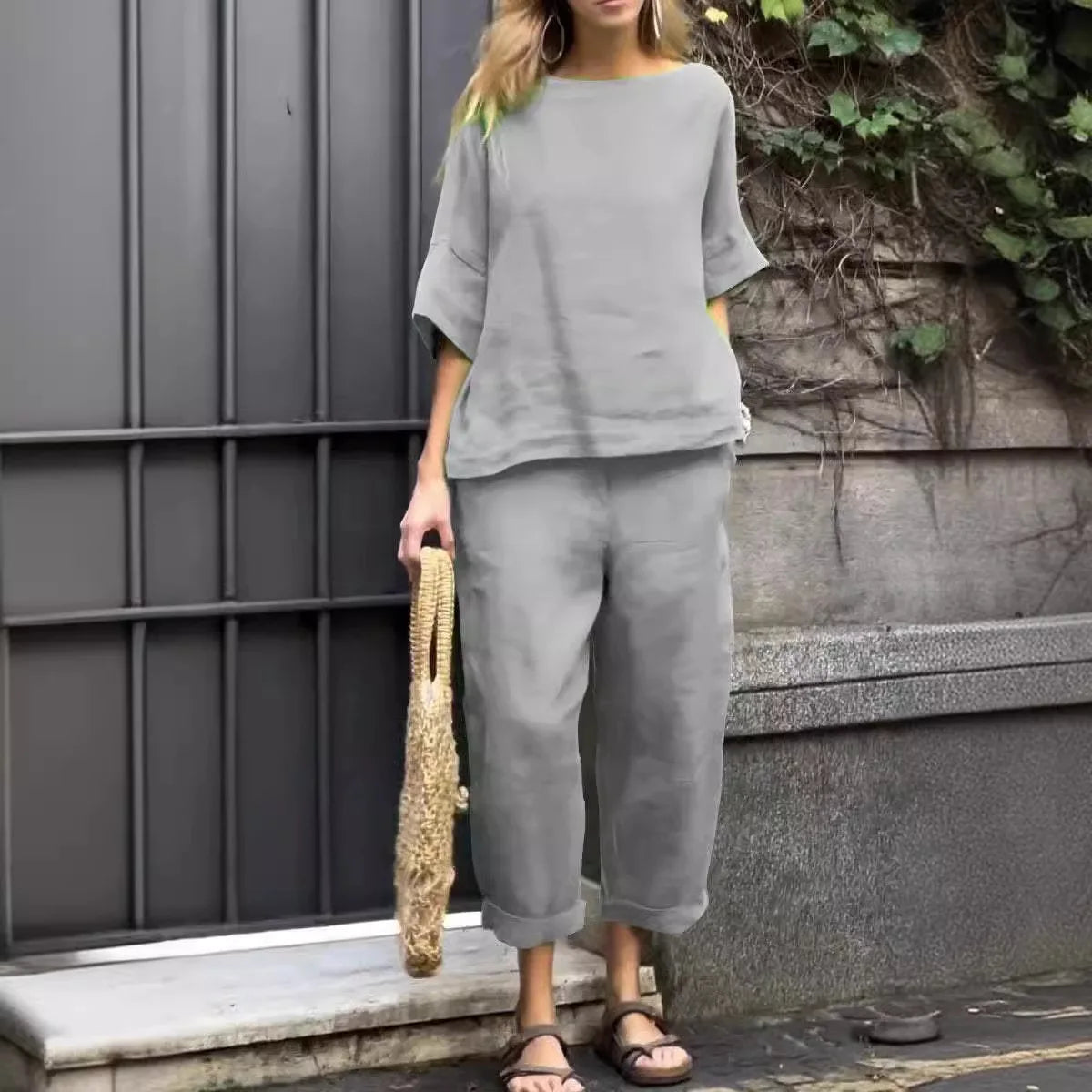 Close-up of luxury plus-size women's shirt showcasing O-neck collar and textured cotton-linen fabric for comfort and style.
