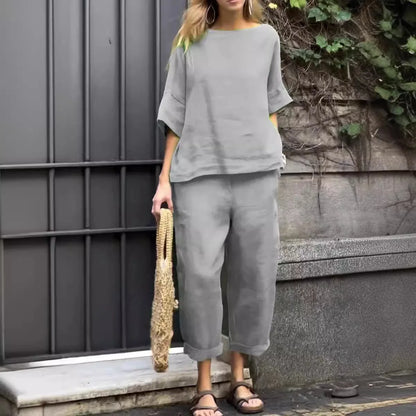 Close-up of luxury plus-size women's shirt showcasing O-neck collar and textured cotton-linen fabric for comfort and style.
