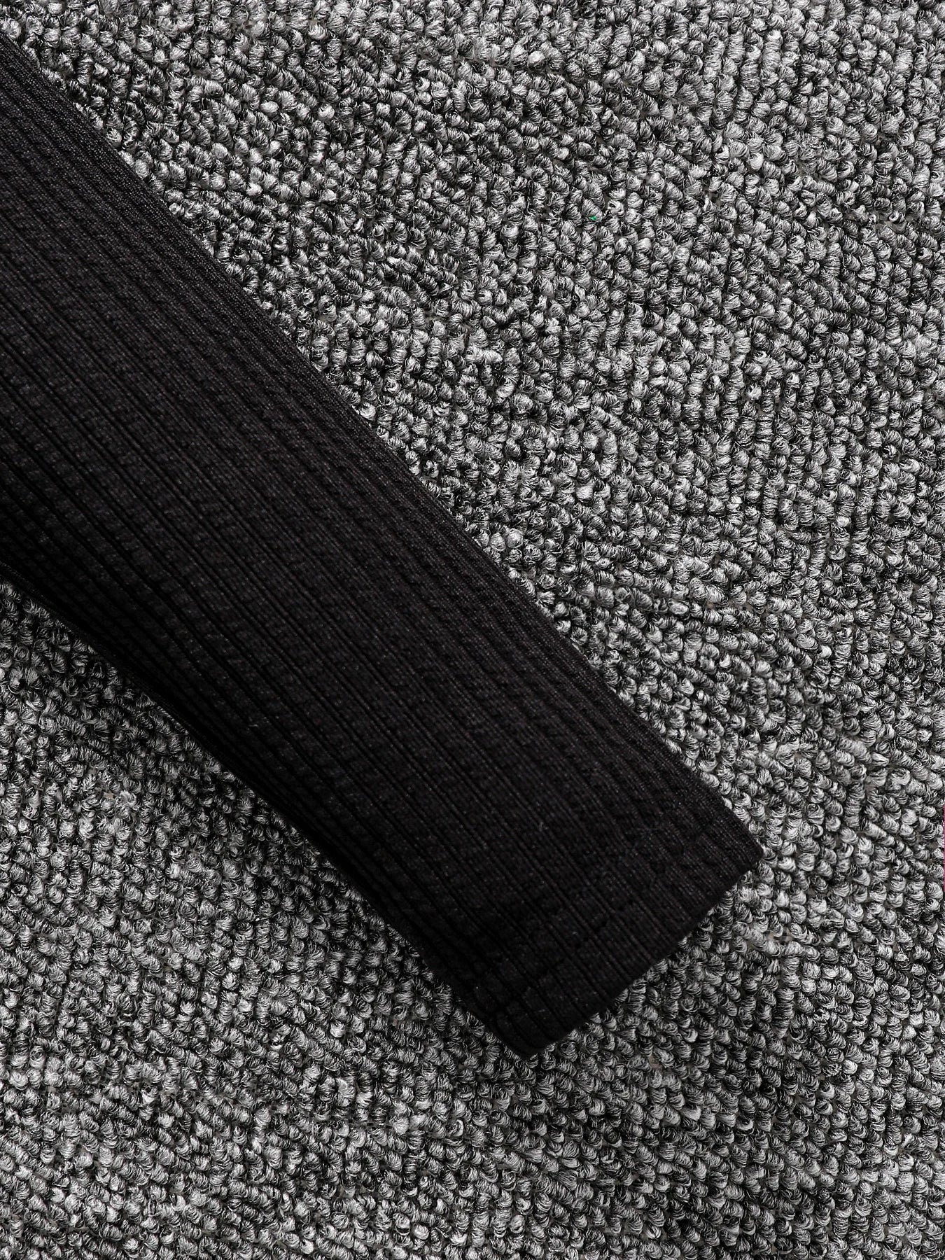 Full view of a luxury 2-piece children's autumn fashion set, showcasing a blend of a black top and stylish camouflage skirt, ideal for young girls.