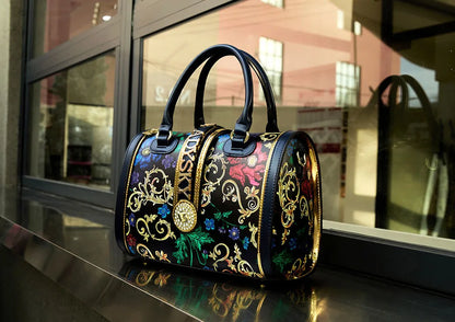 Luxurious women's Boston barrel handbag made from soft microfiber leather featuring a chic animal print design, perfect for upscale fashion enthusiasts.