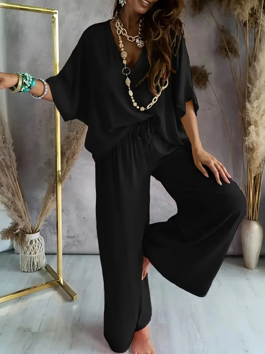 Luxurious women's casual batwing sleeve pants set, featuring wide leg design in lightweight solid polyester, perfect for elegant spring/summer occasions.