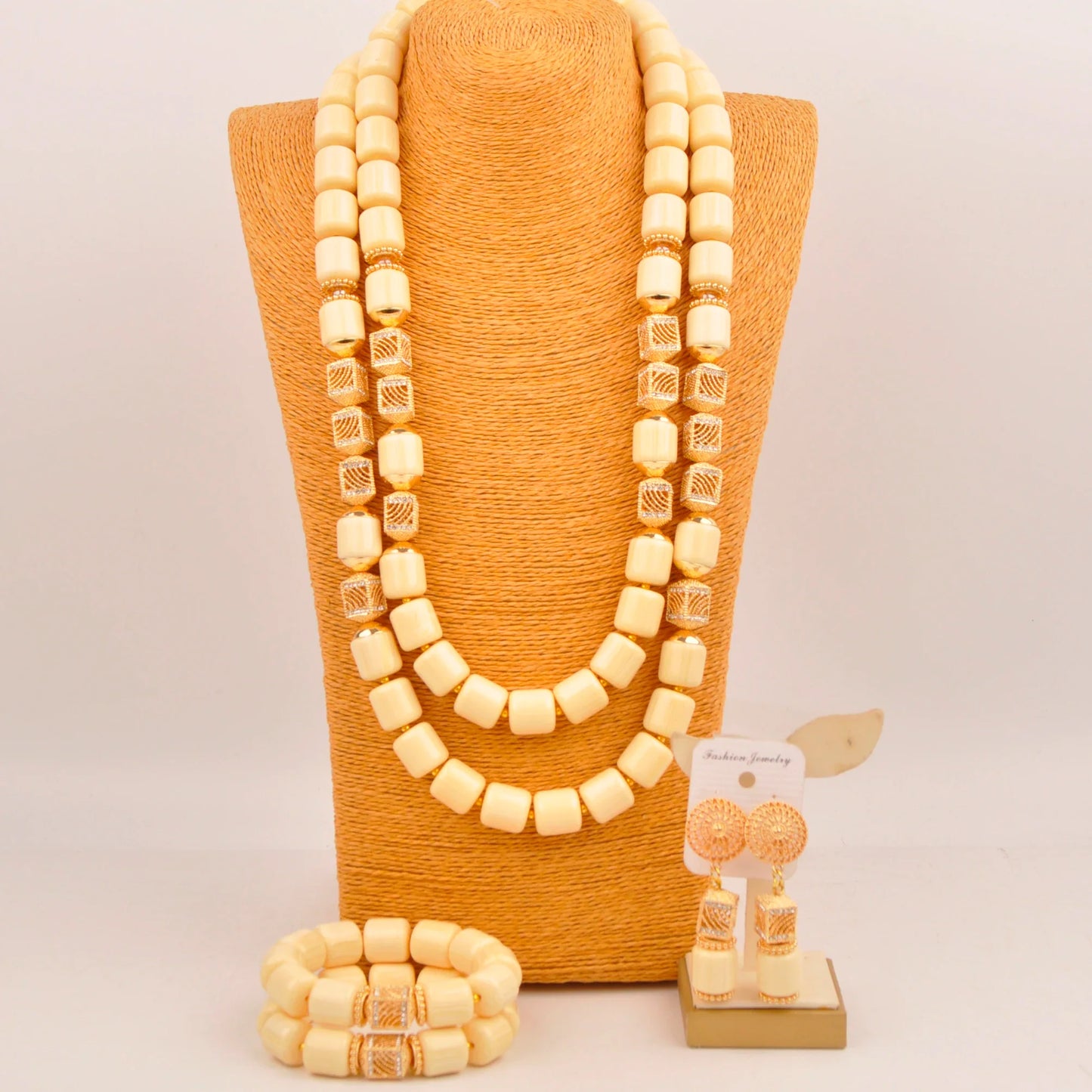 Elegant Nigerian bridal jewelry set featuring artificial coral beads, including a stunning necklace with intricate detailing, perfect for weddings.