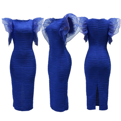 Side view of the luxurious CM.YAYA stripe dress with delicate butterfly sleeves and mid-calf length, ideal for sophisticated spring-summer styling.