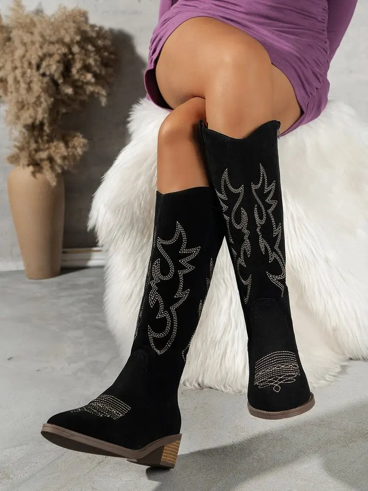 Elegant knee-high Chelsea cowboy boots for women in a sleek punk style, featuring mid heels and a stylish zipper closure, perfect for adding a hint of luxury to any outfit.