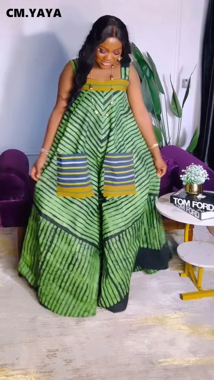 Fashion-forward CM.YAYA Sleeveless Jumpsuit styled with statement heels, epitomising luxury summer attire with its modern striped pattern and high waist fit.