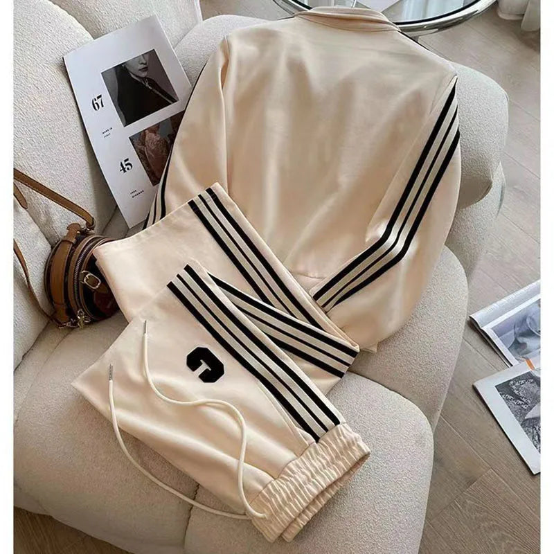 High-End Women's Autumn Winter Leisure Two-Piece Sports Set featuring elegant wide leg pants and a beautifully embroidered coat, ideal for upscale casual outings.