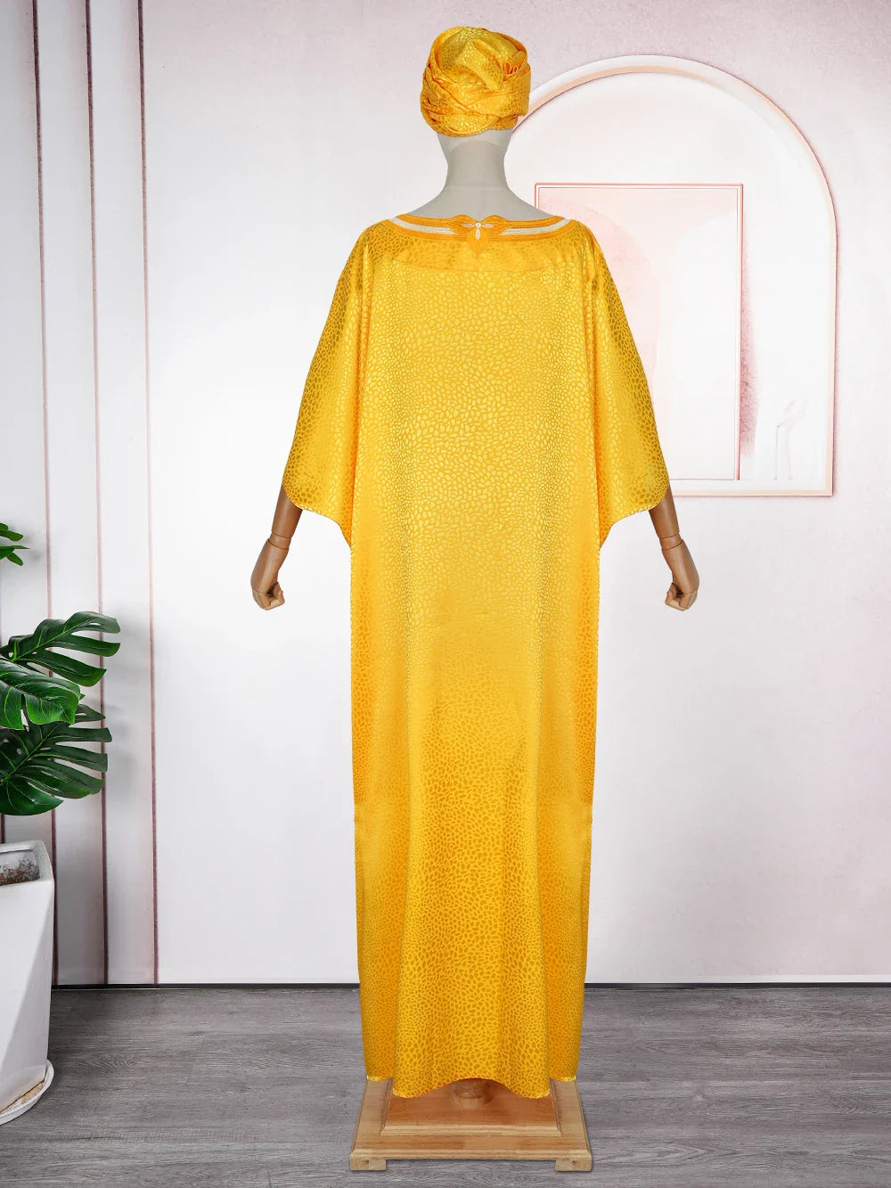 Luxury African Muslim Kaftan for Women, elegant embroidered satin evening dress, showcasing exquisite craftsmanship and a sophisticated design for special occasions.