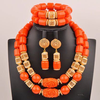 Luxurious Nigerian bridal jewelry set featuring artificial coral beads, including a beautifully designed necklace, bracelet, and earrings, perfect for weddings.