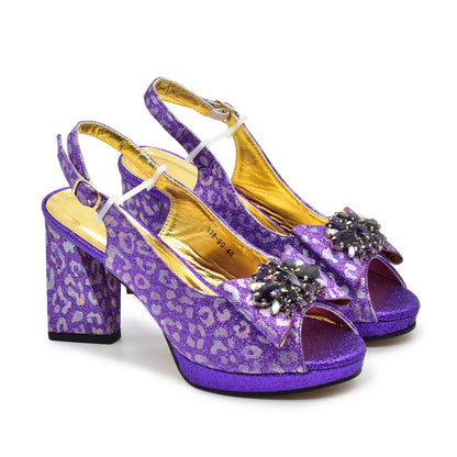 Stylish matching handbag set alongside luxurious purple high heel pumps for women, ideal for any formal occasion.