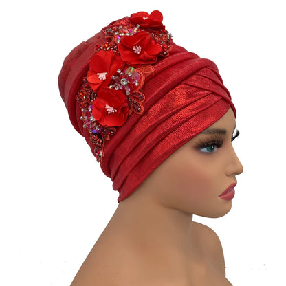 Luxurious African Women's Turban Cap adorned with a sparkling diamond flower and elegant auto gele headtie, perfect for sophisticated occasions and stylish outfits.
