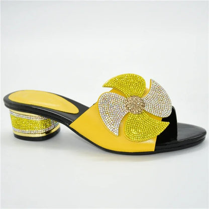 Sophisticated slip-on sandals for women, featuring stylish rhinestone embellishments and a comfortable round toe, available in various fashionable colours.