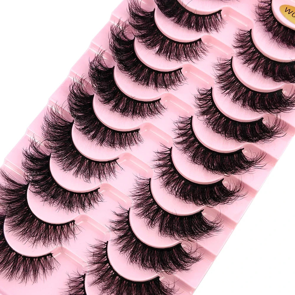 Close-up view of luxurious false eyelashes, featuring soft, wispy strands for a natural yet glamorous appearance.
