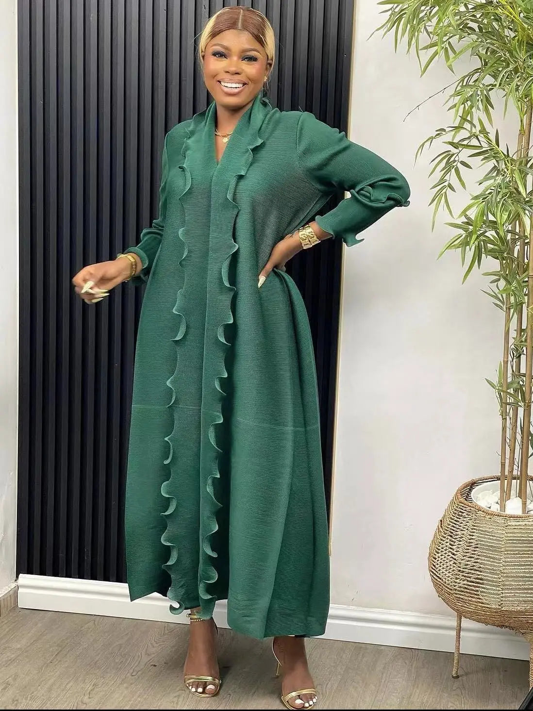 Stunning view of a luxurious loose casual abaya dress with ruffle sleeves, highlighting the sophisticated ankle-length silhouette and feminine sashes for a refined Eid look.