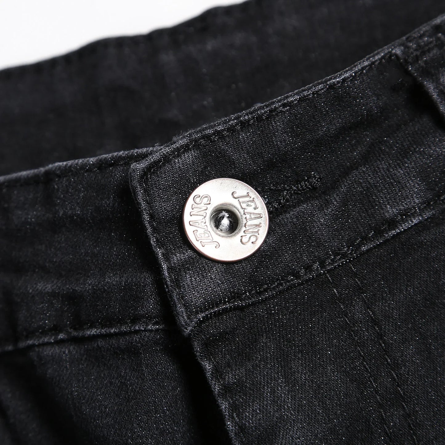 Luxury men's ripped skinny jeans designed in vintage stonewashed denim, epitomising casual elegance with a slim fit style.