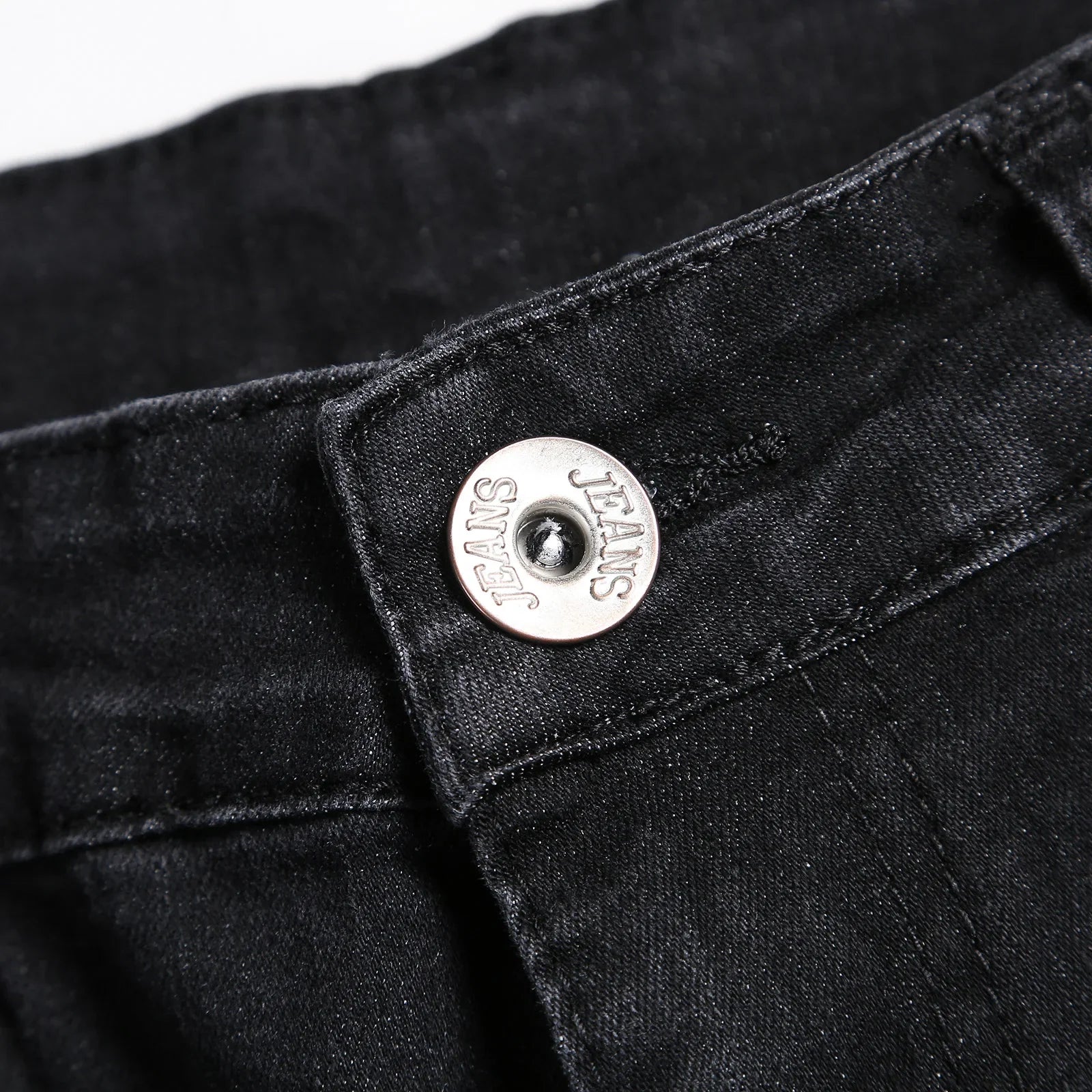 Luxury men's ripped skinny jeans designed in vintage stonewashed denim, epitomising casual elegance with a slim fit style.