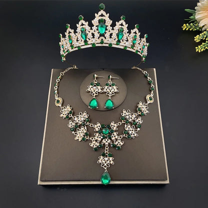 Luxury 3-piece bridal jewelry set displayed elegantly, showcasing a dazzling crown, necklace, and earrings.