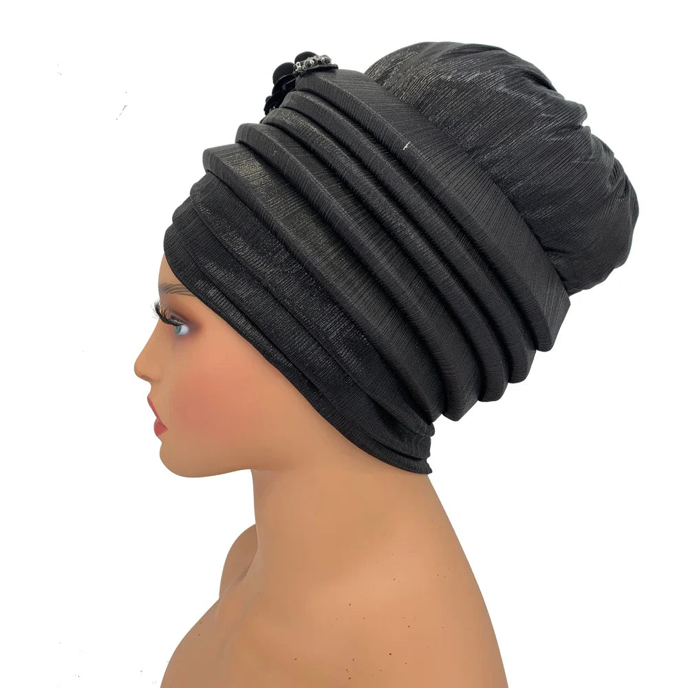 Regual fit turban hat for adult women, offering slight stretch for comfort and a stylish touch to any outfit.