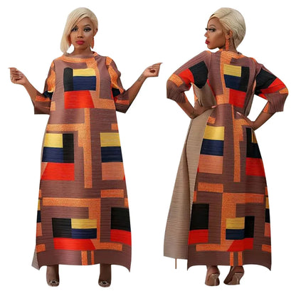 Chic African Plus Size Long Dress featuring vibrant patterns and pleated details, ideal for traditional celebrations and occasions.