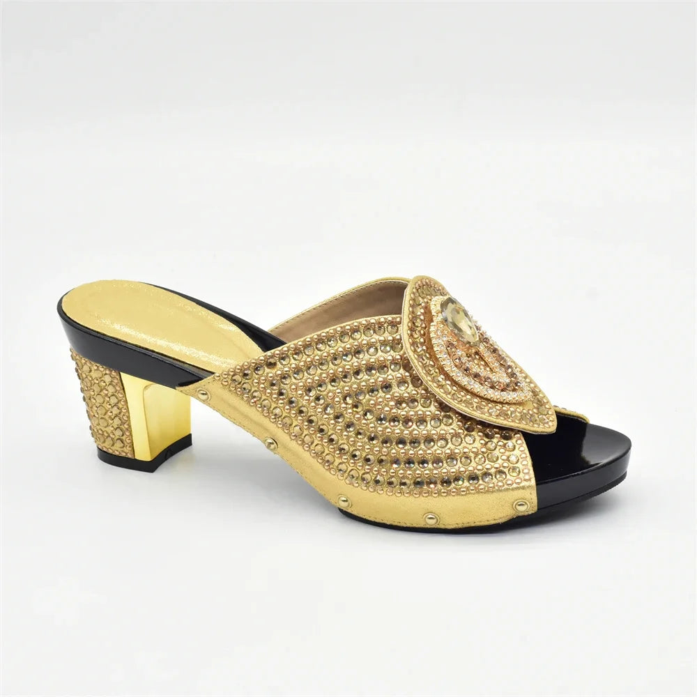 Sophisticated blue high heel pumps with matching handbag, designed for elegant occasions and crafted with rhinestones.