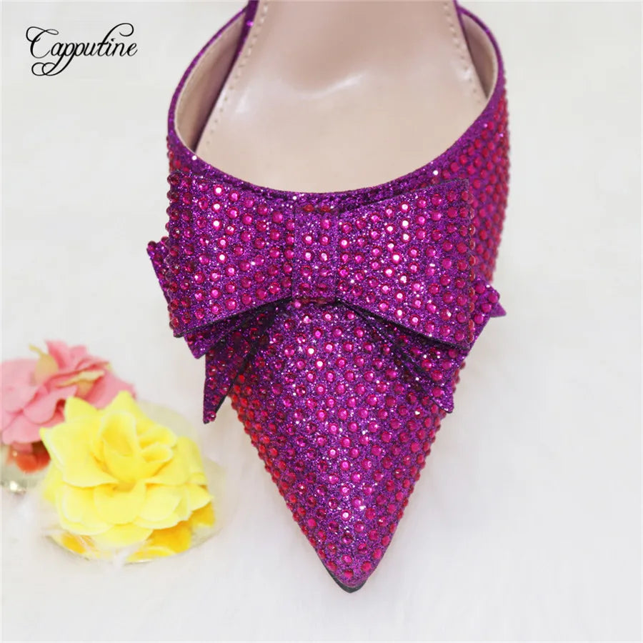 Tastefully designed gold pumps with a secure buckle strap, elegantly paired with a luxurious handbag for a complete fashionable look.