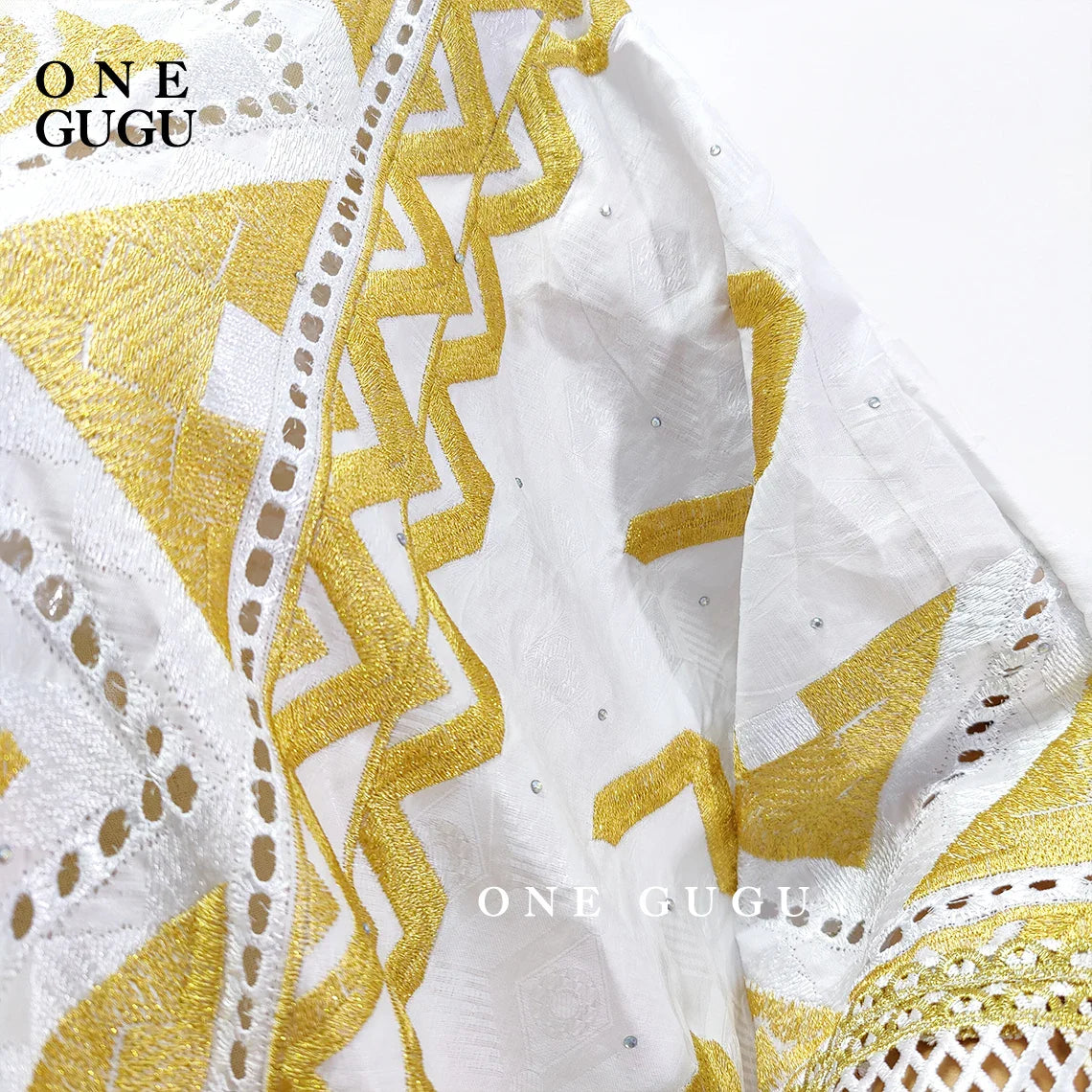 Elegant Original Nigerian Bazin Dress Dashiki in white and gold brocade, adorned with intricate embroidery, ideal for special occasions and traditional events for women.