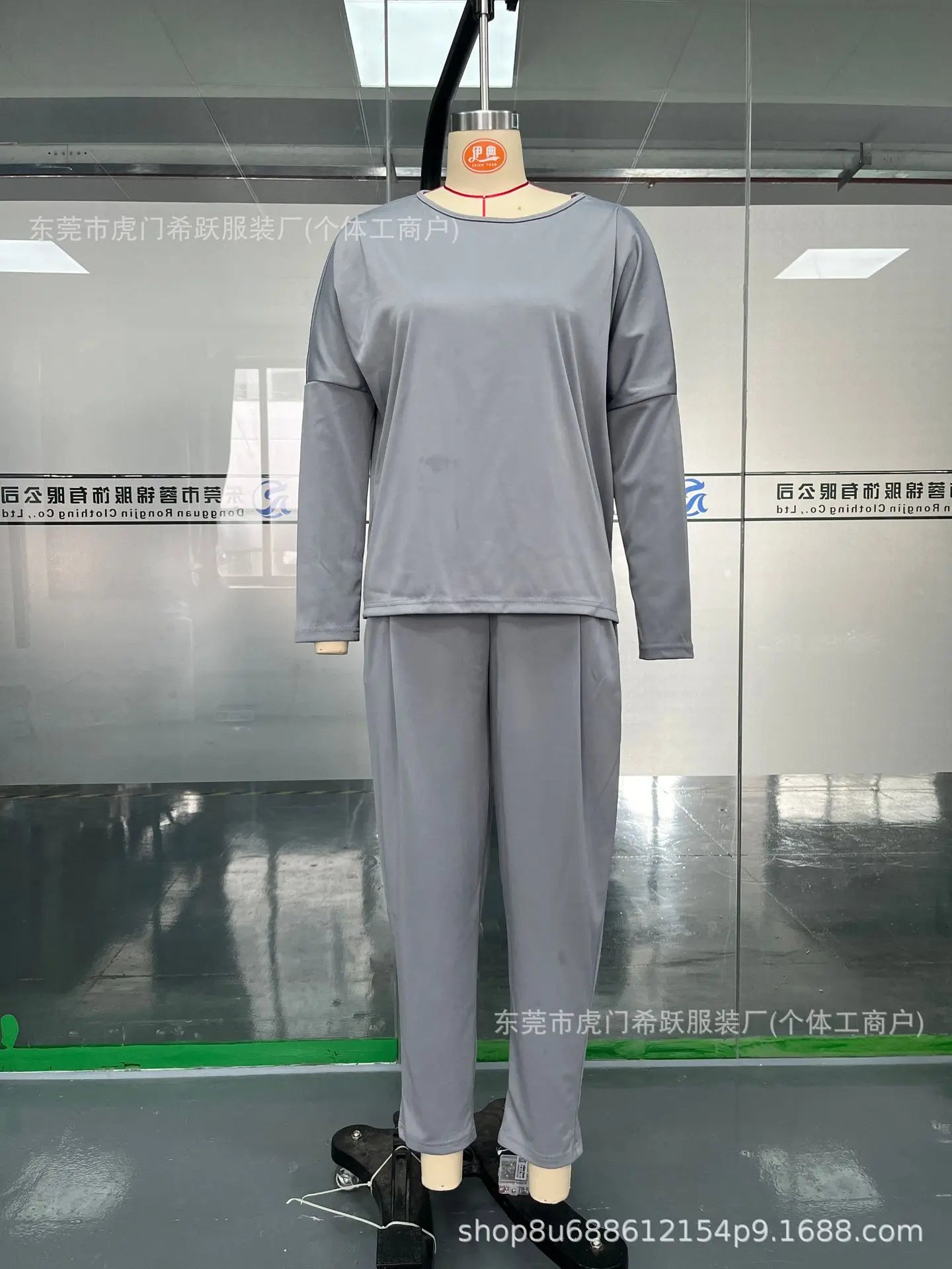 Elegant women's two piece set featuring a luxurious full sleeve O-neck top, paired with stylish midi waist long pants with convenient pockets, perfect for autumn/winter fashion.