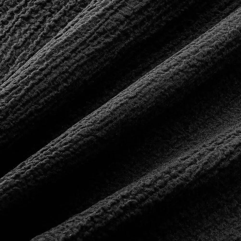 Chic casual summer outfit for men, featuring a finely tailored short sleeve shirt and long pants, perfect for warm weather styling.