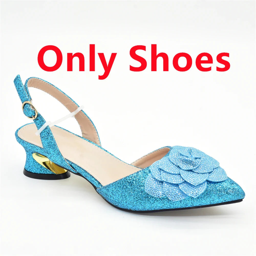 Matching luxury women's bag crafted with rhinestones, perfectly paired with elegant shoe set for special occasions.