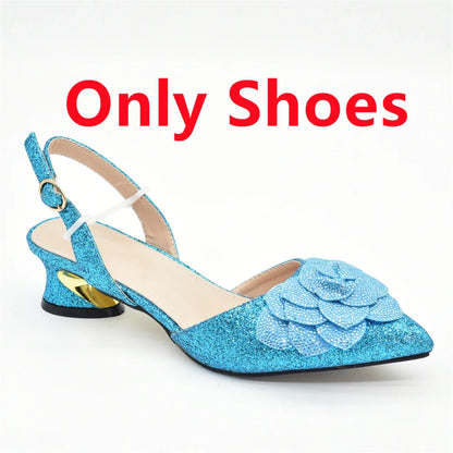 Matching luxury women's bag crafted with rhinestones, perfectly paired with elegant shoe set for special occasions.