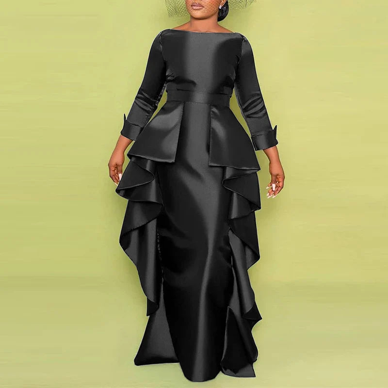 A model showcasing the ankle-length design of the VONDA Plus Size Maxi Dress, perfect for parties and upscale events.