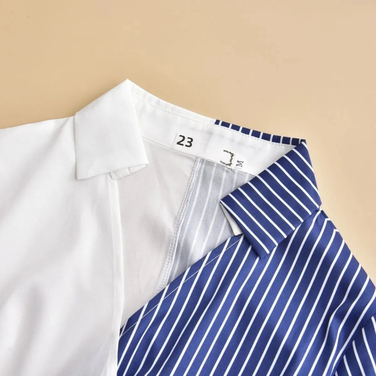 Close-up of the sophisticated patchwork detailing on the shirt of the luxury women's plus size casual set.