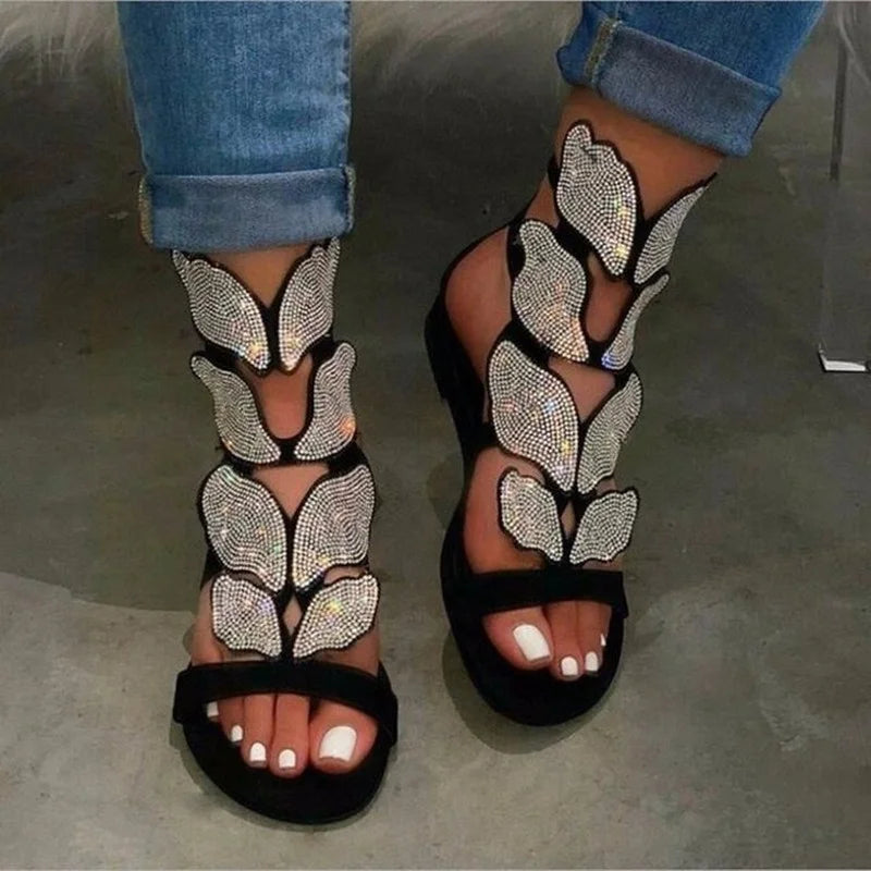 Luxurious women's plus size gladiator sandals featuring an exquisite crystal butterfly detail, perfect for stylish summer outings.