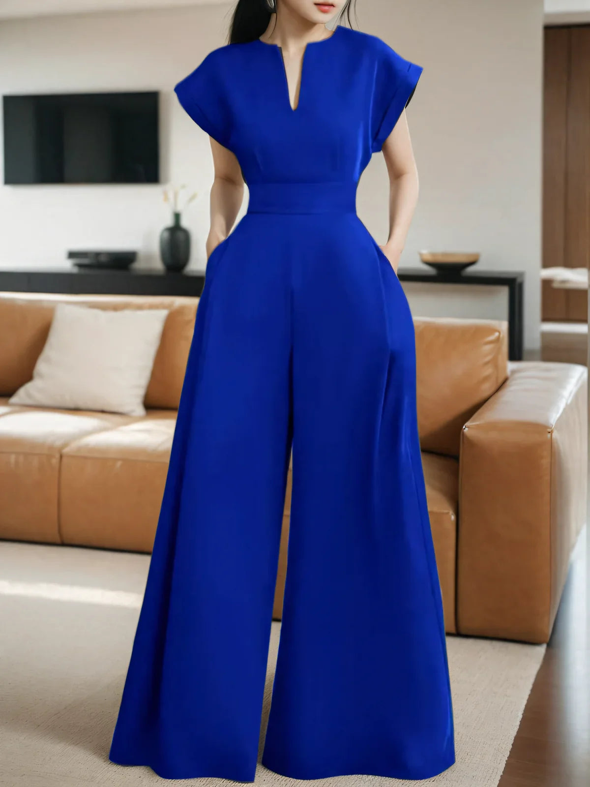 Luxurious sleeveless jumpsuit showcasing solid colour and loose fit, ideal for stylish women's wardrobe.