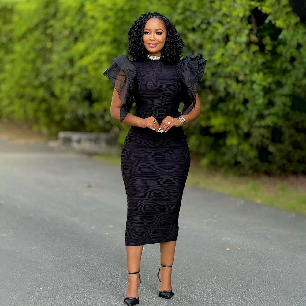 Sophisticated full-length view of the CM.YAYA women's knee length dress, perfect for high-class evening events, illustrating beauty in every detail.