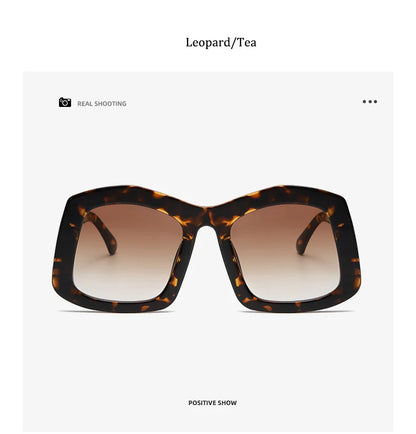 Chic oversized square sunglasses for women in an orange gradient, combining luxury style with polycarbonate frame durability.