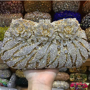 Elegant luxury women's rhinestone evening clutch bag in metallic finish, perfect for parties and formal occasions.