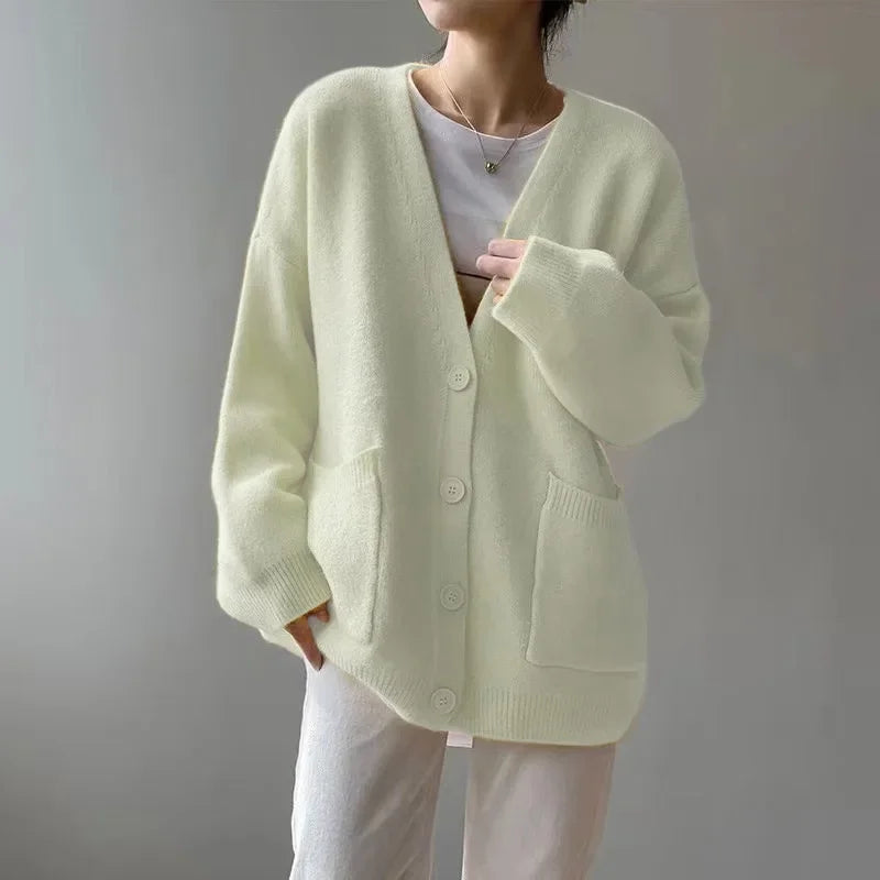 Luxurious Rimocy women's cardigan in soft knitted fabric, highlighting a loose fit and full sleeve for a comfortable yet fashionable look.