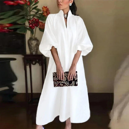 Elegant women’s casual maxi dress in white featuring a v-neck design, ankle-length silhouette, and half sleeves, perfect for upscale parties and events.