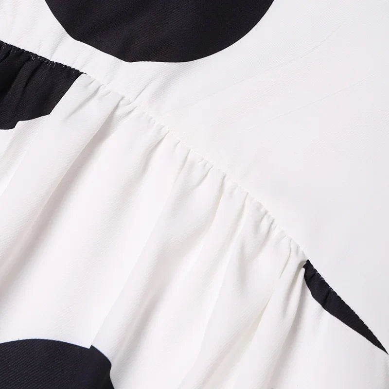 Stylish VONDA Plus Size Bohemian Dress displayed on a mannequin, illustrating its flattering empire waistline and versatile occasions.