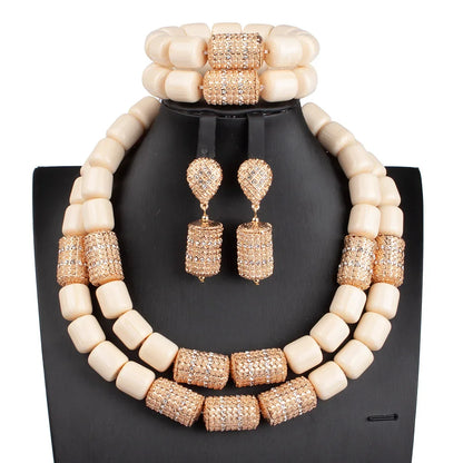 Elegant presentation of the luxury African beads jewellery set on a model, featuring a statement necklace with rich artificial coral, ideal for upscale events.