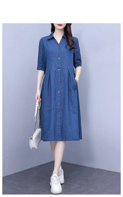 Luxurious oversized 5XL casual denim dress with short sleeves and pockets, exhibiting a sophisticated square collar and a timeless knee-length A-line silhouette.