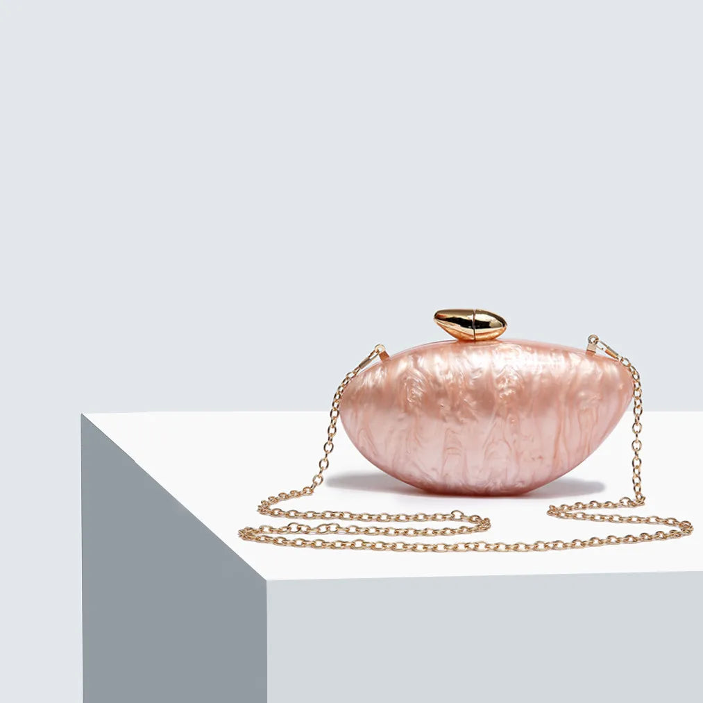 Elegant clutch purse with chain, crafted from high-quality acrylic, ideal for upscale events.