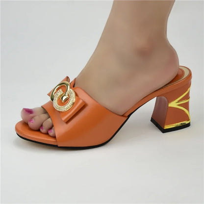 Luxurious gold and orange high heeled sandals for women, featuring a square heel design and exquisite rhinestone detailing, ideal for special occasions.