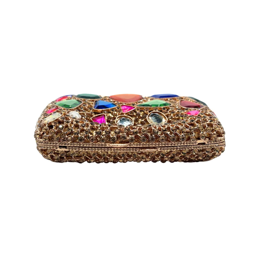 Elegant gold metallic minaudiere clutch with a minimalist design, ideal for pairing with formal attire at parties.