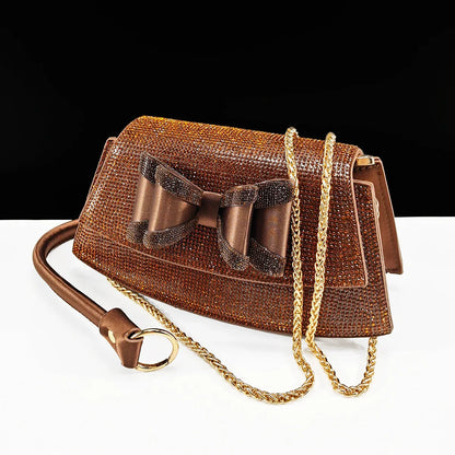 Luxury handbag with long chain shoulder strap, designed to complement the elegant women's rhinestone butterfly shoes, ideal for formal events.