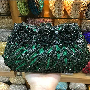 Elegant luxury women's rhinestone evening clutch bag in metallic minaudiere style, perfect for sophisticated parties.