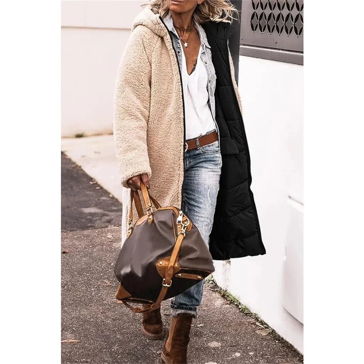 Stylish women's hooded reversible winter jacket with thick padding and elegant quilting, designed for warmth and fashion in winter seasons.